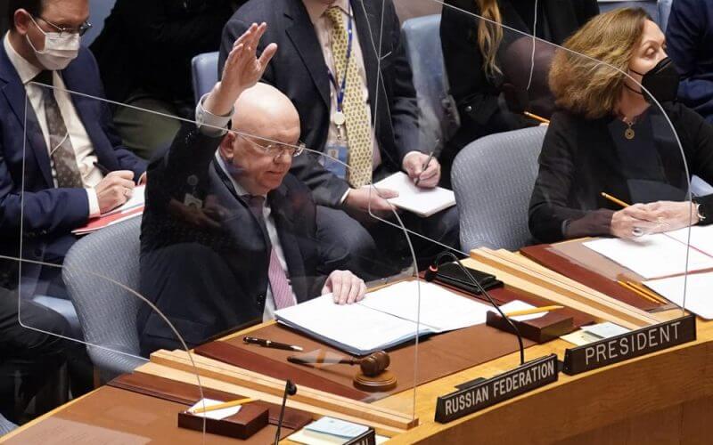 Russia's U.N. Ambassador Russia Vasily Nebenzya casts the lone dissenting vote in the United Nations Security Council, Friday, Feb. 25, 2022. Two days into Russia's attack on Ukraine, a majority of U.N. Security Council members voted to demand that Moscow withdraw. But one thing stood in their way: a veto by Russia itself. Proposals to change the council's structure or rein in the use of vetoes have sputtered for years. But this time, a new approach appears to be gaining some traction. (AP Photo/Seth Wenig, File)
