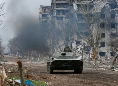 Service members of pro-Russian troops ride an armoured vehicle during fighting in Ukraine-Russia conflict near a plant of Azovstal Iron and Steel Works company in the southern port city of Mariupol, Ukraine April 12, 2022. REUTERS/Alexander Ermochenko