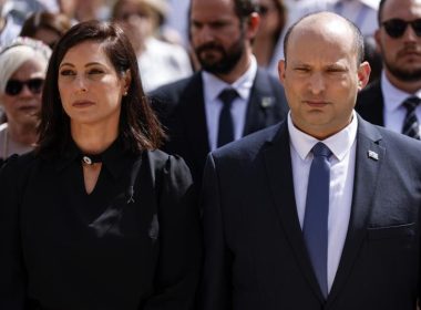 Israeli Prime Minister Naftali Bennett and his wife Gilat take part in the ceremony marking Holocaust Remembrance Day at Warsaw Ghetto Square at the Yad Vashem memorial in Jerusalem, Thursday, April 28, 2022. (Amir Cohen/Pool Photo via AP)