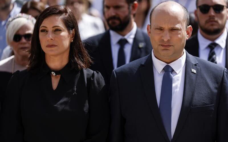 Israeli Prime Minister Naftali Bennett and his wife Gilat take part in the ceremony marking Holocaust Remembrance Day at Warsaw Ghetto Square at the Yad Vashem memorial in Jerusalem, Thursday, April 28, 2022. (Amir Cohen/Pool Photo via AP)