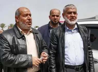 (Front L to R) Hamas ranking members Khalil Al-Hayya and Rawhi Mushtaha stand outside the VIP hall at the Rafah border crossing with Egypt in the southern Gaza Strip on March 15, 2021. AFP Photo / Said Khatib