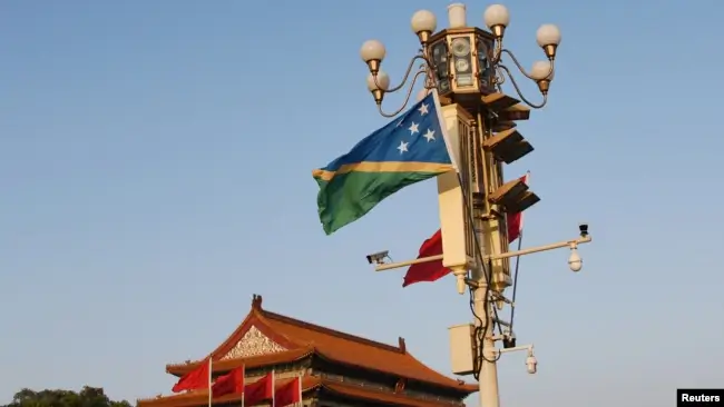 National flags of Solomon Islands and China flutter at the Tiananmen Square in Beijing, China, Oct. 7, 2019. The United States will launch a high-level strategic dialogue with Solomon Islands in September to address mutual security concerns. Reuters