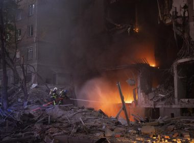 Firefighters try to put out a fire following an explosion in Kyiv, Ukraine on Thursday, April 28, 2022. Russia mounted attacks across a wide area of Ukraine on Thursday, bombarding Kyiv during a visit by the head of the United Nations. (AP Photo/Emilio Morenatti)