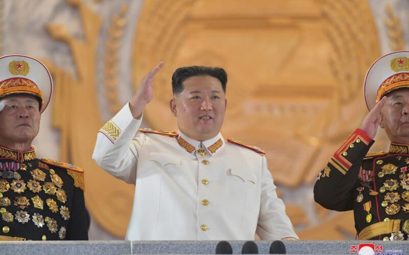North Korean leader Kim Jong-un (C) waves during a military parade at Kim Il-sung Square in Pyongyang on Monday to mark the 90th anniversary of the founding of its army, in this photo released the next day by the North`s official Korean Central News Agency. (Yonhap)