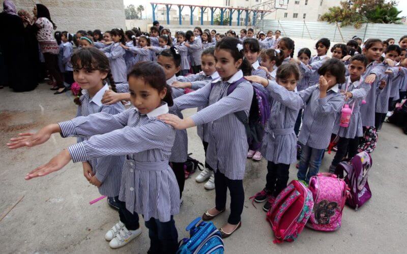 Illustrative. Palestinian students seen on their first day of the new school year in the West Bank city of Ramallah, on August 25, 2013. (Issam Rimawi/FLASH90/File)
