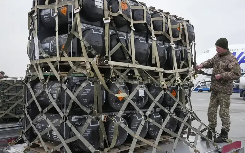 Ukrainian servicemen unpack Javelin anti-tank missiles from the United States on Feb. 11. Over the past two weeks, the Biden administration began shipping more weaponry to Ukraine. | Efrem Lukatsky/AP Photo