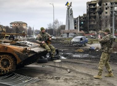 Ukrainian soldiers take pictures with destroyed Russian tanks and armored vehicles. Photo by Vladyslav Musienko/UPI |