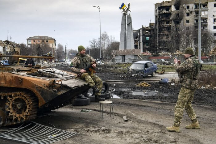 Ukrainian soldiers take pictures with destroyed Russian tanks and armored vehicles. Photo by Vladyslav Musienko/UPI |