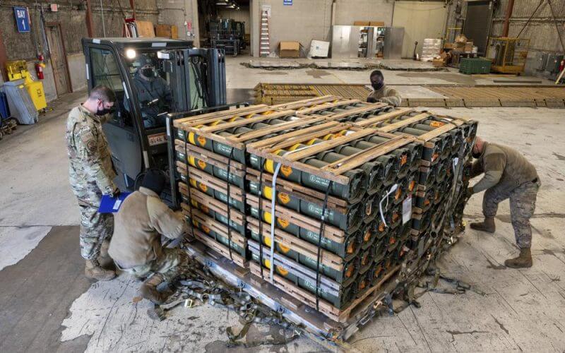 In this image provided by the U.S. Air Force, Airmen and civilians from the 436th Aerial Port Squadron palletize ammunition, weapons and other equipment bound for Ukraine during a foreign military sales mission at Dover Air Force Base, Del., on Jan. 21, 2022. Western weaponry pouring into Ukraine helped blunt Russia's initial offensive and seems certain to play a central role in the approaching battle for Ukraine's contested Donbas region. Yet the Russian military is making little headway halting what has become a historic arms express. (Mauricio Campino/U.S. Air Force via AP)