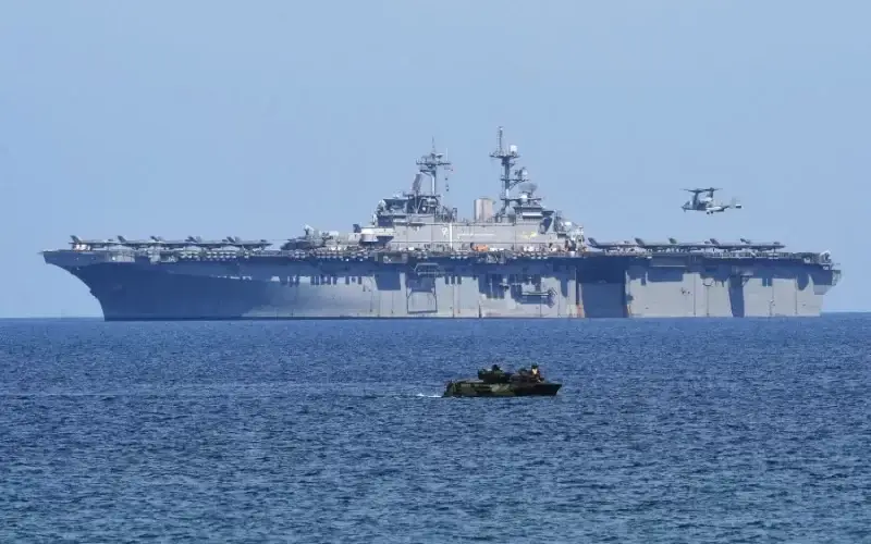 The Chinese Military announced they issued a "warning" to the U.S. Navy for sailing in the Taiwan Strait while China performed military drills. In this photo, a U.S. Marine Amphibious Assault Vehicle (front) maneuvers as a V-22 Osprey prepares to land on the USS Wasp, a U.S. Navy multipurpose amphibious assault ship, during the amphibious landing exercises as part of the annual joint U.S.-Philippines military exercise on the shores of San Antonio town, facing the South China sea, Zambales province, on April 11, 2019. TED ALJIBE/AFP VIA GETTY IMAGES