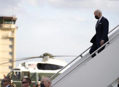 U.S. President Joe Biden, right, disembarks from Air Force One on his arrival at Yokota Air Base, Sunday, May 22, 2022, in Fussa, on the outskirt of Tokyo, Japan. (AP Photo/Evan Vucci)