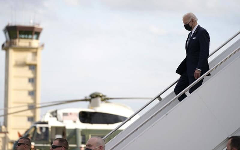 U.S. President Joe Biden, right, disembarks from Air Force One on his arrival at Yokota Air Base, Sunday, May 22, 2022, in Fussa, on the outskirt of Tokyo, Japan. (AP Photo/Evan Vucci)