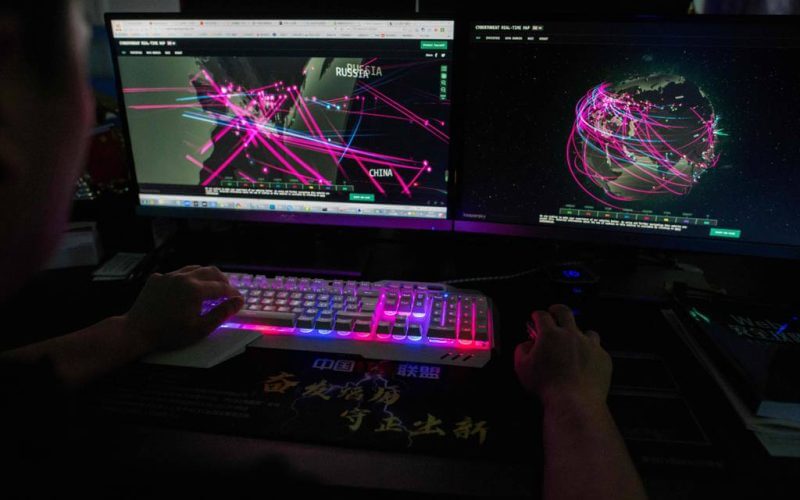 In this file photo taken Aug. 4, 2020, Prince, a member of the hacking group Red Hacker Alliance who refused to give his real name, uses a website that monitors global cyberattacks on his computer at their office in Dongguan, China's southern Guangdong province. (Nicolas Asfouri/AFP via Getty Images)