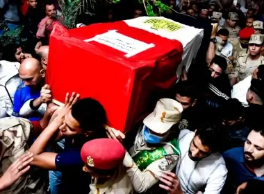 Men carry the coffin of Egyptian soldier Ahmed Mohamed Ahmed Ali during his funeral service in Qalyubia, Egypt, on May 8, 2022. AP Photo/Sayed Hassan