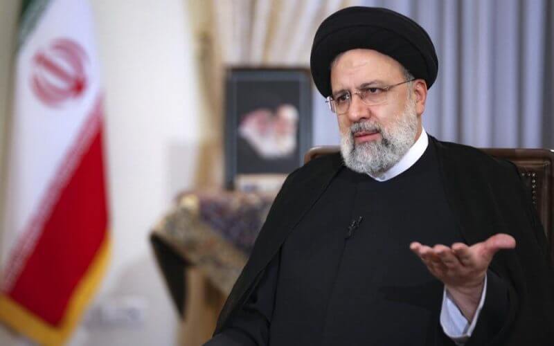 In this photo released by the official website of the office of the Iranian Presidency, President Ebrahim Raisi speaks in a live interview with state-run TV, at the presidency office in Tehran, Iran, Monday, May 9, 2022. Raisi said the country is exporting twice as much oil as when he took office in August, despite heavy sanctions on oil exports imposed by the U.S. (Iranian Presidency Office via AP)