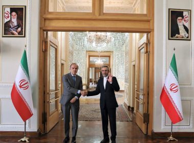 In this photo released by the Iranian Foreign Ministry, Enrique Mora, the European Union coordinator of talks to revive Iran's nuclear accord with world powers, left, shakes hands with Iran's top nuclear negotiator Ali Bagheri Kani, in Tehran, Iran, Wednesday, May 11, 2022. Mora traveled to Tehran as the bloc makes a last-ditch effort to salvage the tattered deal after a weekslong standstill. (Iranian Foreign Ministry via AP)