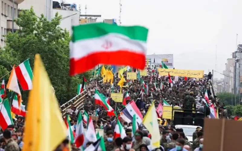 Iranians hold flags during a rally marking the annual Quds Day, or Jerusalem Day, on the last Friday of the holy month of Ramadan in Tehran, Iran April 29, 2022 (photo credit: WANA NEWS AGENCY/REUTERS)