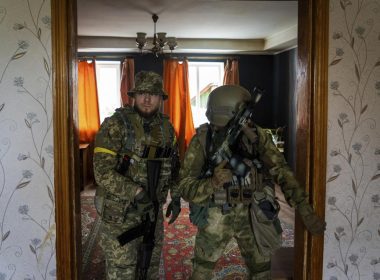 Ukrainian servicemen inspect a house during a reconnaissance mission in a recently retaken village on the outskirts of Kharkiv, east Ukraine, Saturday, May 14, 2022. (AP Photo/Mstyslav Chernov)