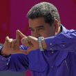 Venezuela's President Nicolas Maduro gestures on stage during a May Day rally in Caracas, Venezuela, Sunday, May 1, 2022. (AP Photo/Ariana Cubillos)