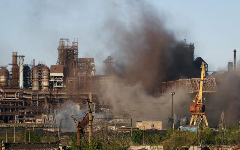 Smoke rises from the Metallurgical Combine Azovstal in Mariupol during shelling, in Mariupol, in territory under the government of the Donetsk People's Republic, eastern Ukraine, May 7, 2022. (AP Photo/Alexei Alexandrov, File)