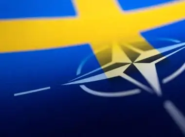 Swedish and NATO flags are seen printed on paper this illustration taken April 13, 2022. REUTERS/Dado Ruvic/Illustration