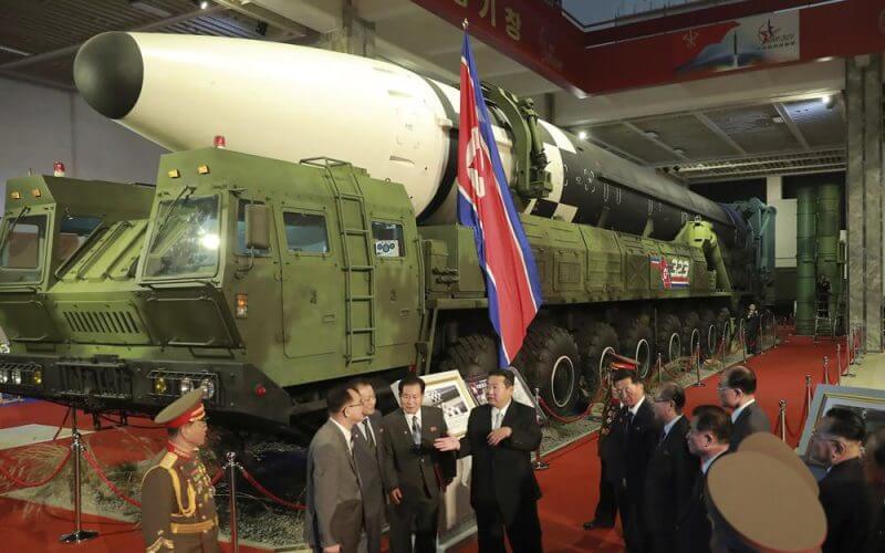 In this photo provided by the North Korean government, North Korean leader Kim Jong Un, center, speaks in front of what the North says an intercontinental ballistic missile displayed at an exhibition of weapons systems in Pyongyang, North Korea, on Oct. 11, 2021. (Korean Central News Agency/Korea News Service via AP, File)