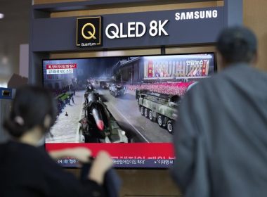 People watch a TV screen showing a news program reporting about North Korea's missile launch with file footage, at a train station in Seoul, South Korea, Wednesday, May 25, 2022. (AP Photo/Lee Jin-man)