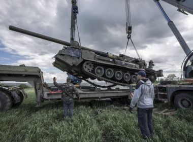 Ukrainian soldiers prepare to lift a destroyed Ukrainian 2S7 Pion tank lying in a field from Russian shelling two nights before east of Kharkiv on Sunday. Ukraine said it managed to push Russian troops back in the area. Photo by Ken Cedeno/UPI
