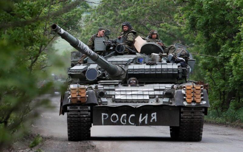 Service members of pro-Russian troops drive a tank during Ukraine-Russia conflict in the Donetsk Region, Ukraine May 22, 2022. The writing on the tank reads: "Russia". REUTERS/Alexander Ermochenko