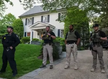 Police stand outside the home of U.S. Supreme Court Chief Justice John Roberts as abortion-rights advocates protest on May 11, 2022, in Chevy Chase, Maryland. (Kevin Dietsch/Getty Images)