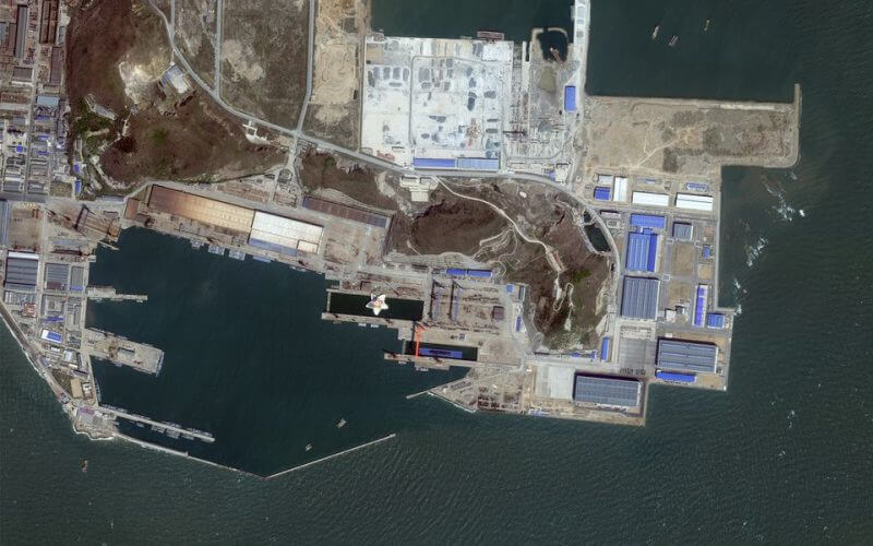 A satellite image taken by Planet Labs show a dry dock in Huludao Port in Liaoning province, China, May 4, 2022. Planet Labs PBC/Handout