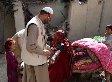 An Afghan woman is treated by a doctor in an area affected by an earthquake in Gayan, Afghanistan, June 23, 2022. REUTERS/Ali Khara
