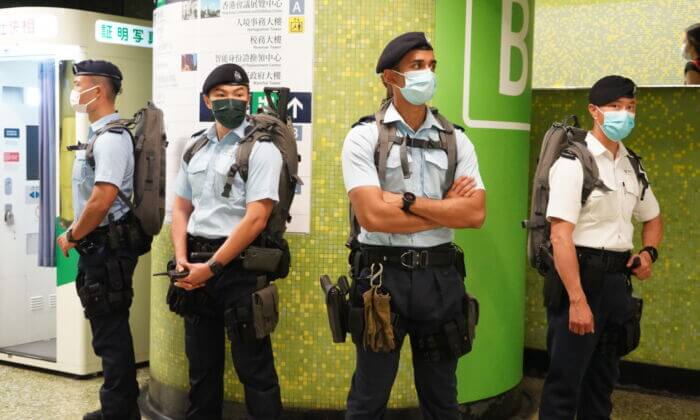 Counterterrorism police guard a metro station in Hong Kong on October 1, 2021. (Sung Pi-lung/The Epoch Times)