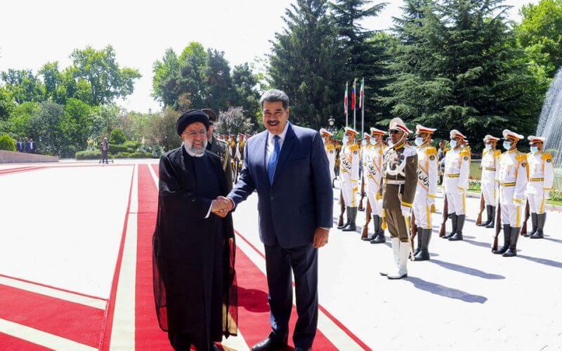 Iranian President Ebrahim Raisi shakes hands with Venezuelan President Nicolas Maduro during a welcoming ceremony, in Tehran, Iran, June 11, 2022. President Website/WANA (West Asia News Agency)/Handout via REUTERS