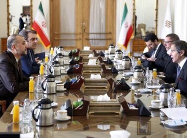 International Atomic Energy Organization Director-General Rafael Mariano Grossi, right, speaks with Iran’s Foreign Minister Hossein Amirabdollahian, left, during their meeting in Tehran, March 5, 2022. (AP Photo)