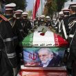 In this photo released by the official website of the Iranian Defense Ministry, military personnel stand near the flag-draped coffin of Mohsen Fakhrizadeh, a scientist who was killed on Friday, during a funeral ceremony in Tehran, Iran, Monday, Nov. 30, 2020. (Iranian Defense Ministry via AP, File)