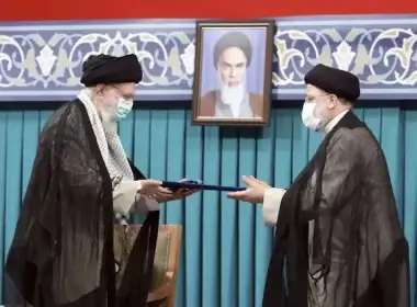 In this file photo, released by an official website of the office of the Iranian supreme leader, Supreme Leader Ayatollah Ali Khamenei, left, gives his official seal of approval to newly elected President Ebrahim Raisi (AP Photo)