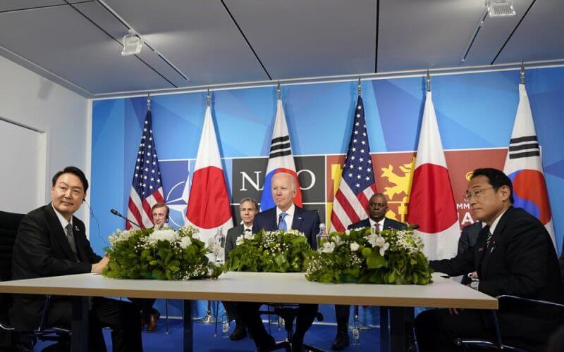 President Joe Biden, center, meets with South Korea's President Yoon Suk Yeol, left, and Japan's Prime Minister Fumio Kishida, right, during the NATO summit in Madrid, Wednesday, June 29, 2022. (AP Photo/Susan Walsh)