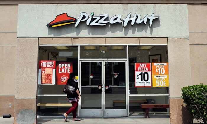 A customer walks in to a Pizza Hut restaurant. (Kevork Djansezian/Getty Images)