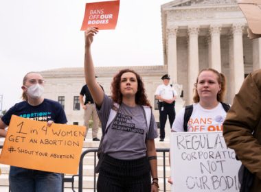 Activists protest in response to the leaked Supreme Court draft decision to overturn Roe v. Wade in front of the U.S. Supreme Court in Washington, May 3, 2022. (Louis Chen/The Epoch Times)