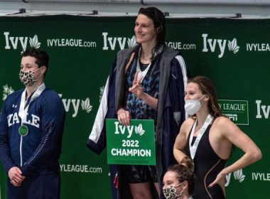 Transgender swimmer Lia Thomas (2nd L) of Penn University and transgender swimmer Iszac Henig (L) of Yale pose with their medals after placing first and second in the 100-yard freestyle swimming race at the 2022 Ivy League Women's Swimming & Diving Championships at Harvard University in Cambridge, Mass., on Feb. 19, 2022. (Joseph Prezioso/Getty Images)
