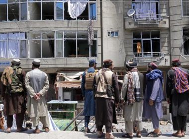Taliban fighters gather at the site of an explosion in front of a Sikh temple in Kabul, Afghanistan, Saturday, June 18, 2022. (AP Photo/Ebrahim Noroozi)