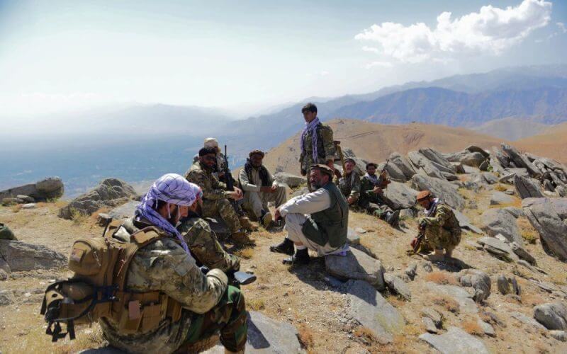 Afghan resistance movement and anti-Taliban uprising forces take a rest as they patrol on a hilltop in Panjshir province, Afghanistan, on Sept. 1, 2021. AHMAD SAHEL ARMAN/AFP VIA GETTY IMAGES