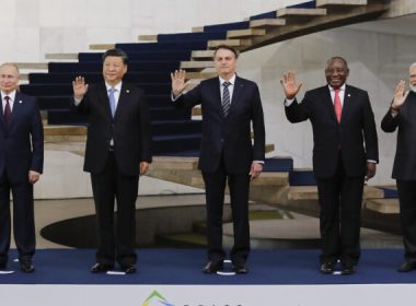Russian President Vladimir Putin, Chinese leader Xi Jinping, Brazilian President Jair Bolsonaro, South African President Cyril Ramaphosa, and Indian Prime Minister Narendra Modi pose for a family picture during the 11th BRICS Summit in Brasilia, Brazil, on Nov. 14, 2019. (Sergio Lima/AFP via Getty Images)