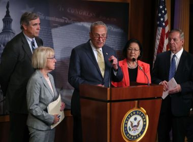 Senate Majority Leader Chuck Schumer (D., N.Y.) with members of his caucus / Getty Images