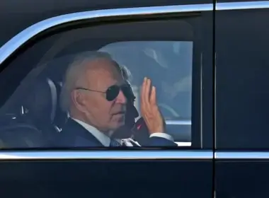 US President Joe Biden waves as he leaves Israel's Ben Gurion Airport, on his way to Jersualem, near Tel Aviv, Israel, July 13, 2022 (photo credit: GIL COHEN-MAGEN/POOL VIA REUTERS)