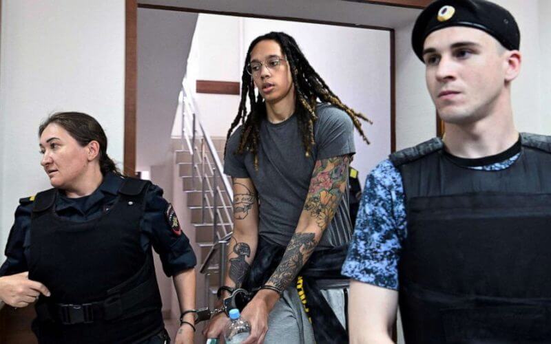 U.S. basketball star Brittney Griner, in handcuffs, arrives to hearing in Khimki court outside Moscow, June 27, 2022. Griner, a two-time Olympic gold medallist and WNBA champion, was detained at Moscow airport in February on charges of carrying in her luggage vape cartridges with cannabis oil, which could carry a 10-year prison sentence. Kirill Kudryavtsev/AFP via Getty Images