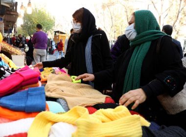 Women shop in a street in Tehran, Iran, November 29, 2021. Majid Asgaripour/WANA (West Asia News Agency) via REUTERS