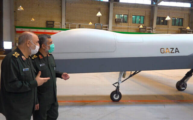 Iranian Revolutionary Guard Commander Gen. Hossein Salami, left, and the Guard's aerospace division commander Gen. Amir Ali Hajizadeh talk while unveiling a new drone called 'Gaza,' in an undisclosed location in Iran, in a photo released on May 22, 2021. (Sepahnews of the Iranian Revolutionary Guard, via AP)