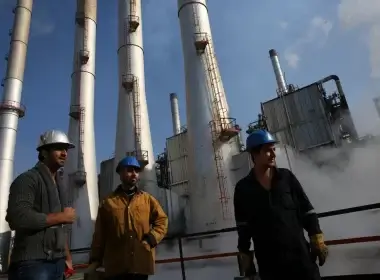 Iranian oil workers gather at an oil refinery south of Tehran. Vahid Salem/AP Photo